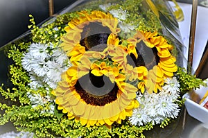 Beautiful bouquet with sunflower with white aster flowers