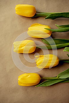 beautiful bouquet of yellow tulips on craft paper. gifts for moms, spring holidays, Flowers packaging