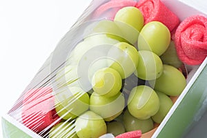 Beautiful boxed Shine Muscat green grape isolated on white background