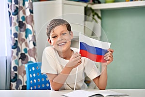 a beautiful boy with the flag of Russia. Russia Day