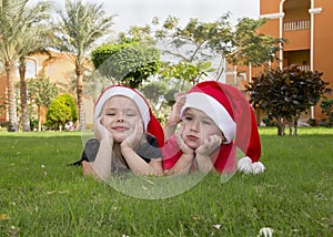 Beautiful boy and girl in santa hats