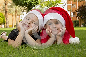 Beautiful boy and girl in santa hats