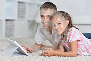 Beautiful boy and girl with tablet pc