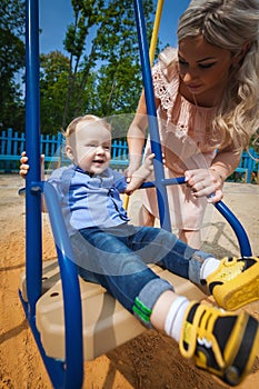 Beautiful boy on swing