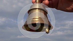 Beautiful brass bell sound in and sky background