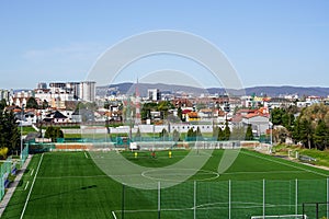 Beautiful Bratislava cityscape in early spring sunny morning with the soccer field in the foreground