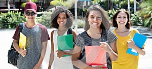 Beautiful brazilian female student with group of international s