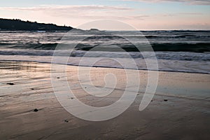 Beautiful breaking waves on sandy beach on atlantic ocean, basque country, france