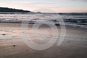 Beautiful breaking waves on sandy beach on atlantic ocean, basque country, france