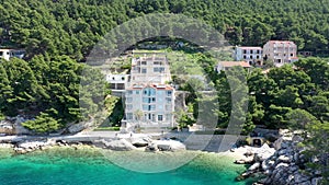 Beautiful Brela on Makarska riviera, Croatia. Adriatic Sea with amazing turquoise clean water and white sand. Aerial view of Brela