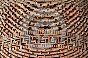 Beautiful brickwork of medieval Uzgen Minaret - ancient town in Osh Region, Kyrgyzstan,Central Asia,unesco heritage