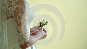 Beautiful bridal bouquet in hands of young bride dressed in white wedding dress. Close up of big bunch of fresh white