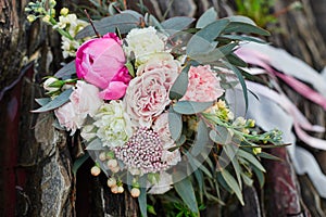 Beautiful Bridal bouquet lying on the stones. A bouquet for the girl`s wedding ceremony. Beautiful delicate flowers