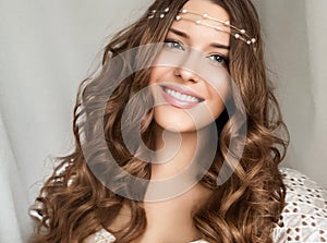 Beautiful bridal look, bride with long hair, wearing pearl tiara jewellery and beauty makeup, woman with curly hairstyle