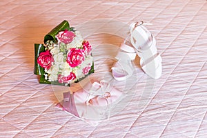 Wedding bouquet, bride shoes and wedding rings