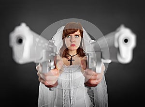 Beautiful bride armed with two pistols
