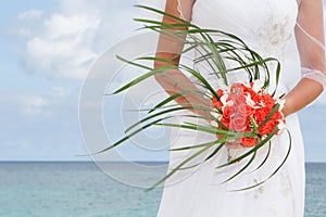 Beautiful bride with bridal bouquet on natural background
