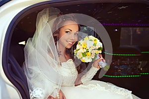 Beautiful bride with bridal bouquet posing