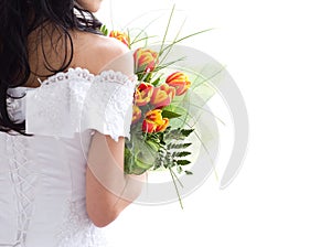 Beautiful bride with bunch of tulips