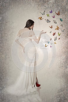 Beautiful bride with butterflies