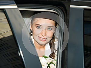 Beautiful bride in the car