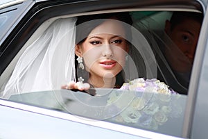 Beautiful bride in car