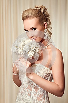 Beautiful bride in elegant white lace wedding dress