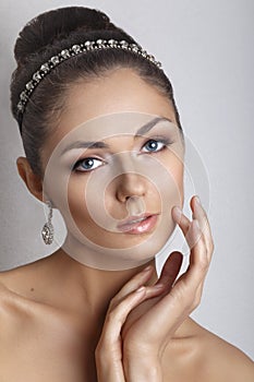 Beautiful bride with fashion wedding hairstyle - on white background.Closeup portrait of young gorgeous bride. Wedding.