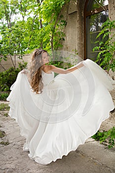 Beautiful bride girl walking at wedding day, happy woman in blow