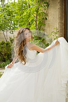 Beautiful bride girl walking at wedding day, happy woman in blow