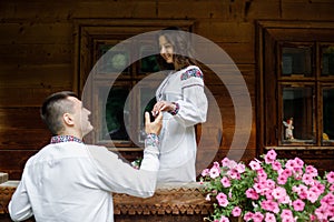 Beautiful bride and groom in the ukrainian style are standing w