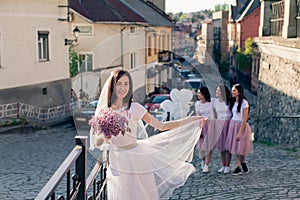 Beautiful bride with her bridesmaids enjoing hen party