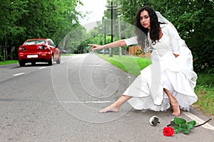 Beautiful bride hitch-hike