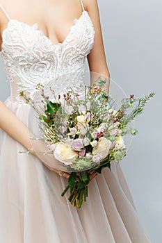 Beautiful bride holding bridal bouquet