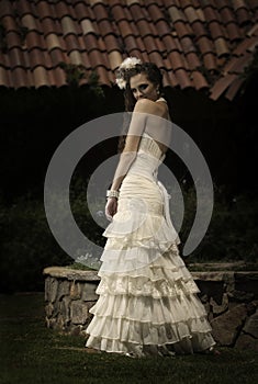 Beautiful bride looking flirtatiously over her shoulder