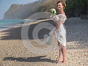 Beautiful bride married at the beach, Bali. Wedding ceremony