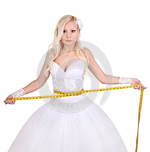 Beautiful bride with measuring tape