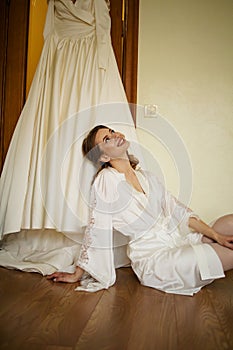 Beautiful Bride In The Morning Of Wedding Day With Her Dress Trying