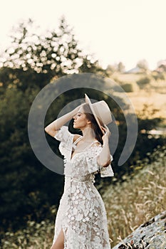 Beautiful bride in nature in boho style. Wedding in the European style of fineart at sunset.