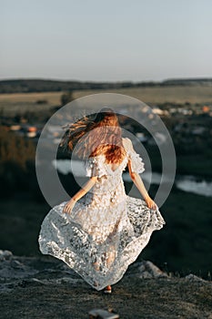 Beautiful bride in nature in boho style. Wedding in the European style of fineart at sunset.