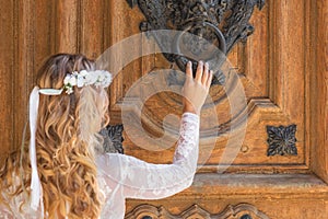 Beautiful bride portrait on old wooden door background