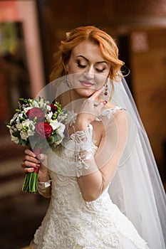 Beautiful bride portrait wedding makeup and hairstyle, Bride in veil and jewelry at home. Bride wedding morning