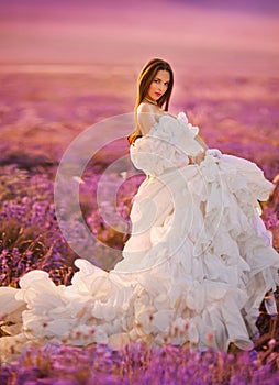 Beautiful bride posing at field of lavender