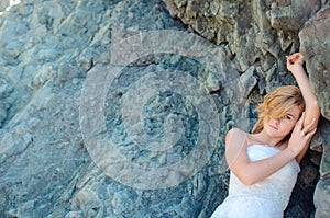 Beautiful bride posing in high mountain scenery