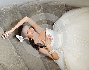 Beautiful bride posing outdoor in her wedding day