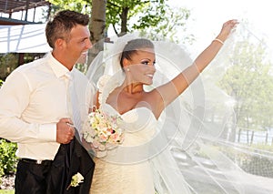 Beautiful bride posing in wedding gown