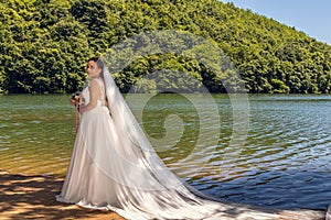 A beautiful bride in the Sakligol Lake, Turkey photo