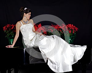 Beautiful Bride Sitting on a Piano