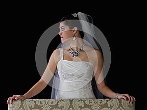 Beautiful Bride Standing Behind Chair