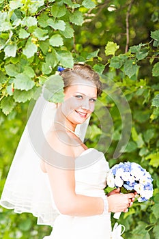 Beautiful bride with stylish make-up in white